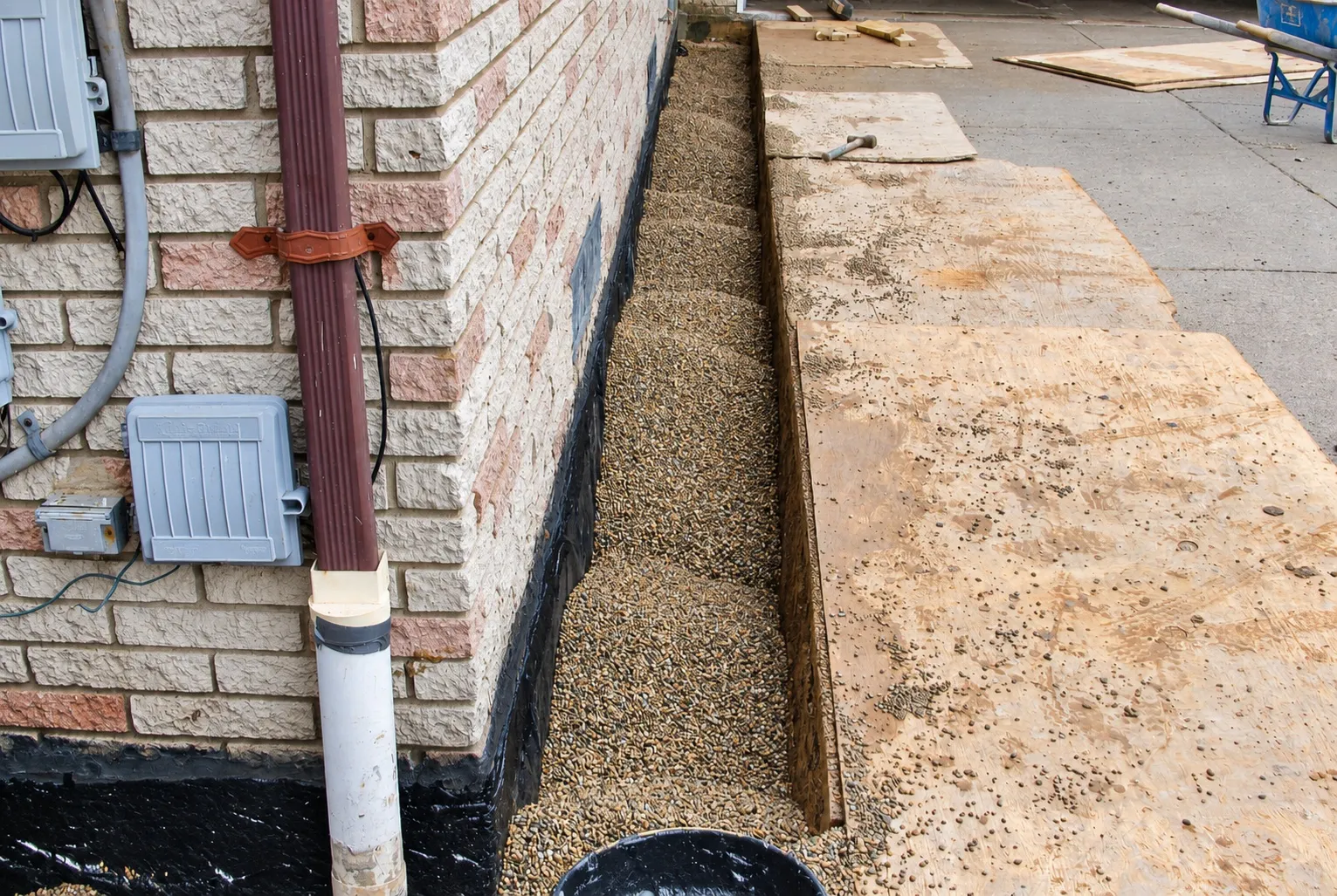 Pea stone backfilled along the foundation over new drain tile